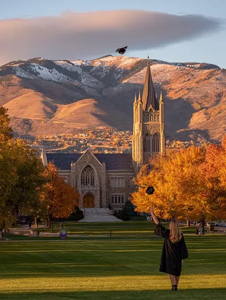 Graduate throwing hat