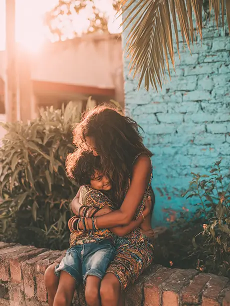 Mother and child hugging